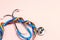 Stethoscope with LGBT rainbow ribbon on pink background