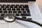 Stethoscope lies on the laptop keyboard.