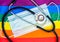 Stethoscope and medical mask on the rainbow flag, LGBT