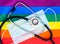 Stethoscope and medical mask on the rainbow flag, LGBT