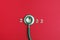 Stethoscope number 2022 on red background creative idea new trend medical banner calendar cover closeup with copy space