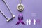 Stethoscope and person with purple ribbon on purple background, Symbol of Alzheimers awareness, Healthcare and medicine concept