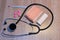 Stethoscope, pill, thermometer and bandage on wood background, m