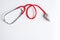 Stethoscope red color with mouse on desk,Medicine online concept