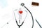 Stethoscope and red heart. Doctor table with medical items