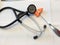 Stethoscope rubber reflex hammer on white background