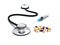 Stethoscope, syringe and pills