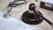 Stethoscope on table, gavel striking on sound block, injury compensation, crime