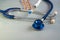 Stethoscope textured background, pills, thermometer, syringe