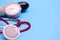 Stethoscope and tonometer on a gray background. A device for listening to the lungs. Instrument for determining pressure. Place fo