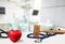 Stethoscope, wooden gavel and heart on table