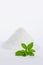 Stevia with a pile of sugar vertical