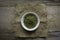 Stevia powder in white plate on rug sack on wooden background