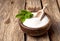 Stevia rebaudiana, sweet leaf sugar substitute isolated in wooden bowl on wooden background