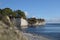 Stevns Klint, chalk cliff in the southeast of the Danish island Zealand in the Baltic Sea, a tourist attraction against a blue sky