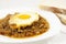 Stew with baked onion, egg and meat