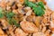 Stew beans with mushrooms, chicken, close-up in selective focus