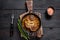 Stew veal shank meat OssoBuco, italian osso buco steak. Black wooden background. Top view