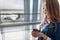 Stewardess with coffee on seat in waiting area