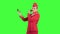 Stewardess looks in the mirror and paints her face with a tassel. Green screen