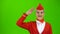 Stewardess in a red suit salutes the pilot. Green screen