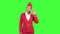 Stewardess in a red suit winks a slight flirt. Green screen