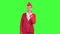 Stewardess in a red suit winks a slight flirt sends an air kiss. Green screen