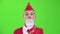 Stewardess in a red suit winks a slight flirt sends an air kiss. Green screen. Slow motion. Close up