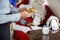 Stewardess Serving Cookies To Santa In Private Jet