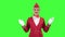 Stewardess shows with a gesture that everyone would stay on the ground. Green screen