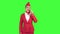 Stewardess speaks on the phone and paces into the distance. Green screen.