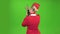 Stewardess speaks on the walkie talkie. Green screen. Back view