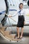 Stewardess Standing On Ladder Of Private Jet