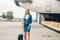 stewardess with suitcase on aircraft parking