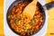 Stewed colorful vegetables in frying pan on cooker