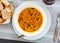 Stewed curried chickpeas with spinach on white plate