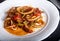 Stewed squid rings with tomato sauce and chilli