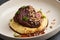 Stewed veal cheeks with mashed potatoes on a white plate, close-up