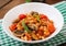 Stewed white beans with mushrooms and tomatoes with spicy sauce