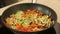 Stewing vegetables in a wok