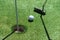 Stick with a ball on an artificial golf