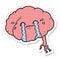 sticker of a cartoon brain with headache