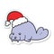 sticker of a cartoon christmas walrus