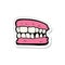 sticker of a cartoon false teeth