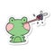 sticker of a cartoon frog catching fly