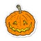 sticker of a cartoon grinning pumpkin
