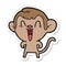 sticker of a cartoon laughing monkey