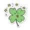 sticker of a happy cartoon four leaf clover