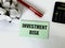 Sticker with the inscription investment risk