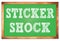 STICKER SHOCK words on green wooden frame school blackboard